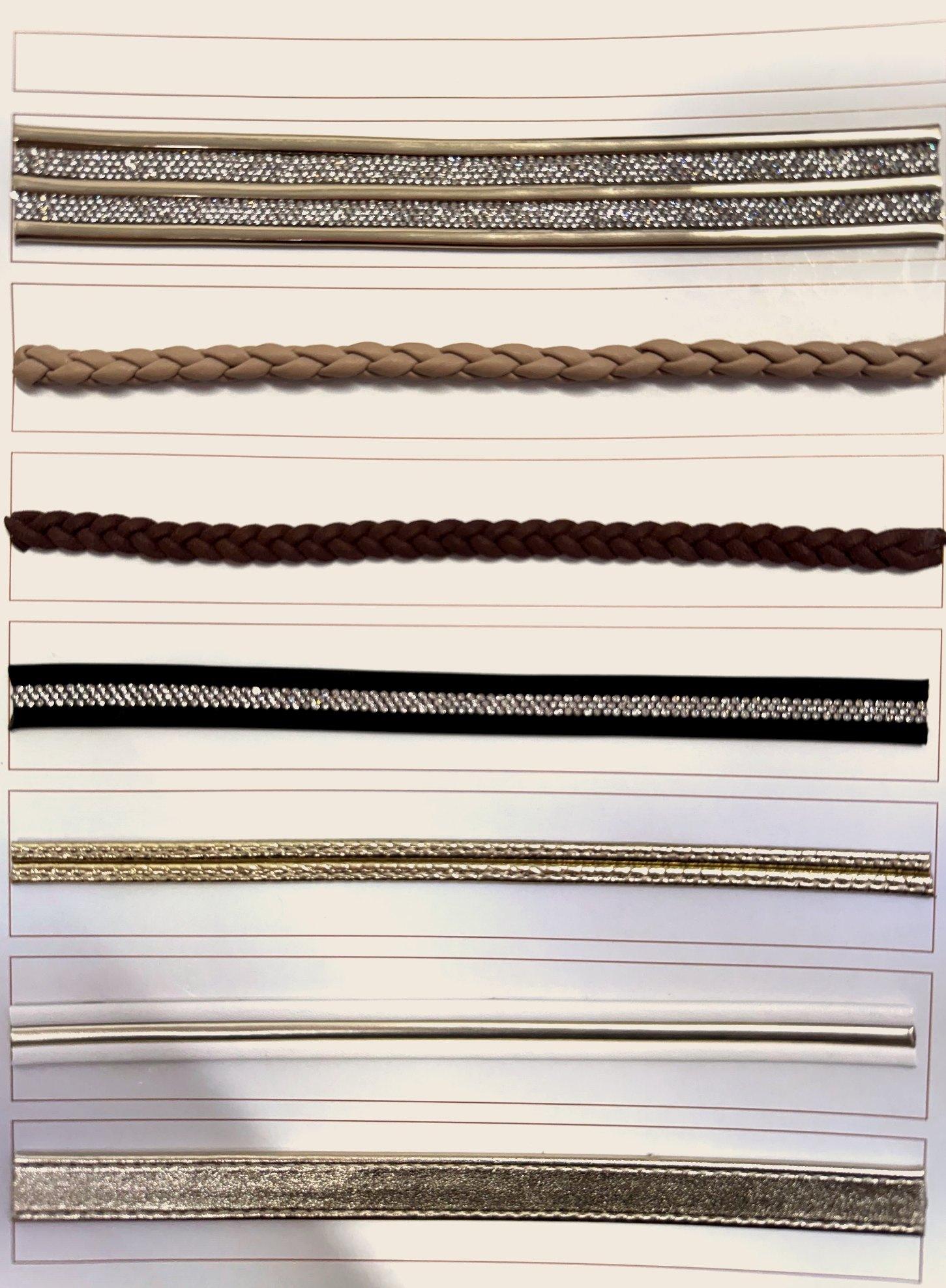 Mostruário com tiras de strass, trançadas e metalizadas